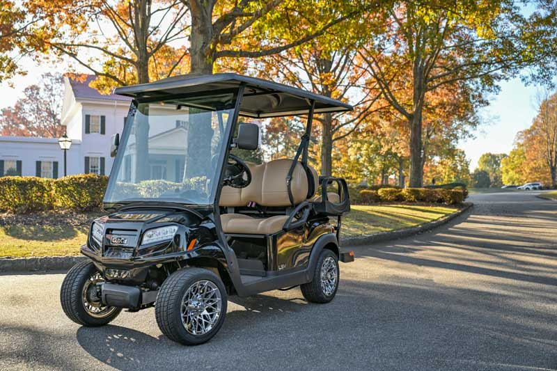 Parked golf cart on autumn street